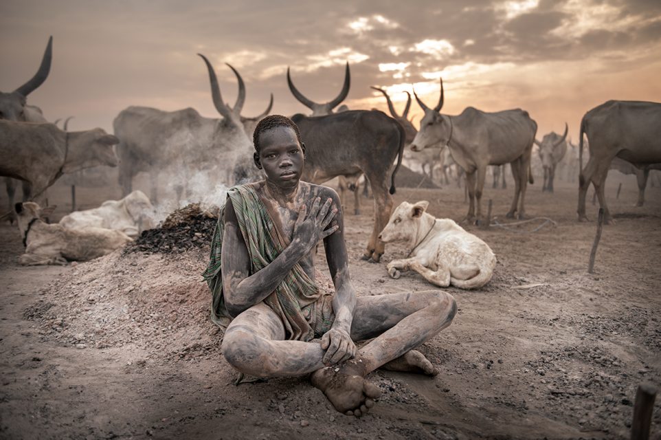 Boy seated on a Sudan Photo Tour